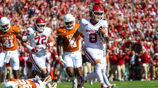 Oklahoma Sooners quarterback Dillon Gabriel (No. 8) rushes into the end zone for a touchdown against the Texas Longhorns in the Red River Showdown 