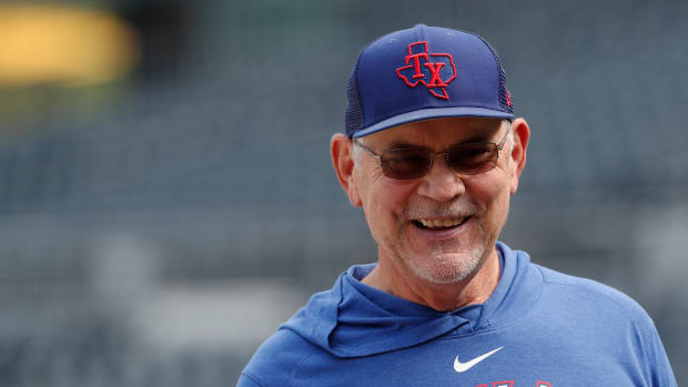 May 23, 2023; Pittsburgh, Pennsylvania, USA; Texas Rangers manager Bruce Bochy (15) smiles on the field before the game against the Pittsburgh Pirates at PNC Park. Mandatory Credit: Charles LeClaire-USA TODAY Sports