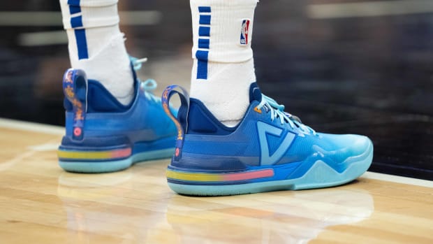 View of Andrew Wiggins' blue and pink shoes.
