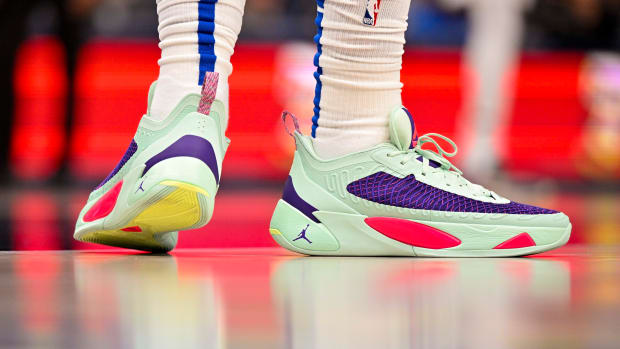 View of Luka Doncic's green and purple Jordan shoes.