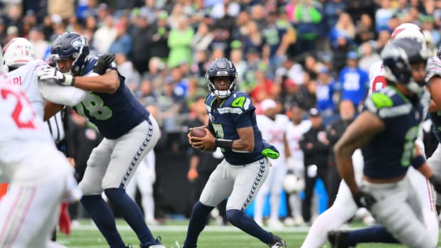 Oct 22, 2023; Seattle, Washington, USA; Seattle Seahawks quarterback Geno Smith (7) looks to pass the ball against the Arizona Cardinals during the second half at Lumen Field. Mandatory Credit: Steven Bisig-USA TODAY Sports