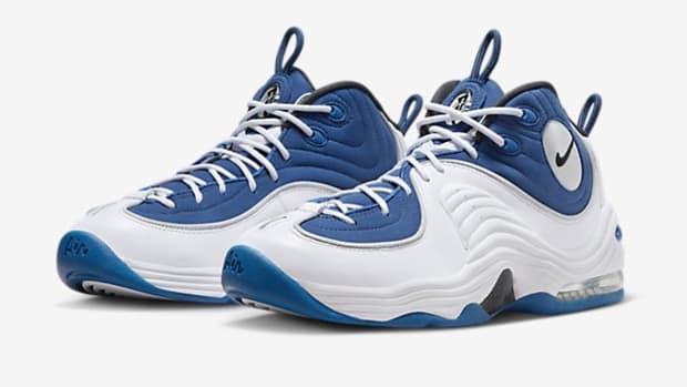 Side view of Penny Hardaway's blue and white Nike sneakers.