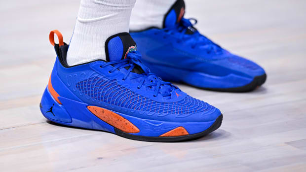 View of blue and orange Jordan Luka shoes.