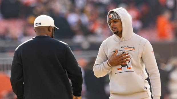 Nov 19, 2023; Cleveland, Ohio, USA; Cleveland Browns quarterback Deshaun Watson (4) talks with Pittsburgh Steelers head coach Mike Tomlin during warm ups before the game at Cleveland Browns Stadium.