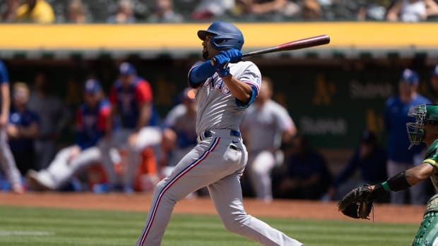 May 28, 2022; Oakland, California, USA; Texas Rangers second baseman Marcus Semien (2) hits a grand slam during the fifth inning against the Oakland Athletics at RingCentral Coliseum. Mandatory Credit: Stan Szeto-USA TODAY Sports