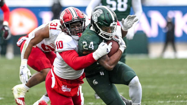 Myles Jackson tackles Elijah Collins during Indiana's double-overtime win at Michigan State on Nov. 19, 2022.