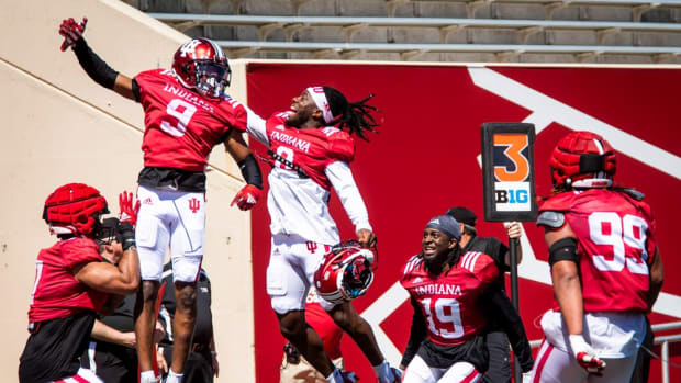 Indiana's Noah Pierre (0) and the defense congratulate Jamier Johnson (9) for his interception of Tayven Jackson (2) during Indiana football's Spring Football Saturday event at Memorial Stadium on Saturday, April 15, 2023.