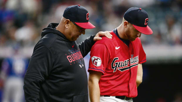 Sep 16, 2023; Cleveland, Ohio, USA; Cleveland Guardians starting pitcher Tanner Bibee (61) walks off the field with manager Terry Francona during the sixth inning against the Texas Rangers at Progressive Field. Bibee left the game with an injury. Mandatory Credit: Ken Blaze-USA TODAY Sports