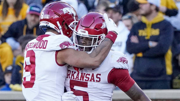 Arkansas Razorbacks running back Raheim Sanders (5) celebrates with wide receiver Jadon Haselwood (9) after scoring against the Missouri Tigers during the first half at Faurot Field at Memorial Stadium.