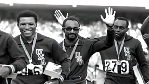 Charlie Greene (center) after the Olympic gold medal ceremony
