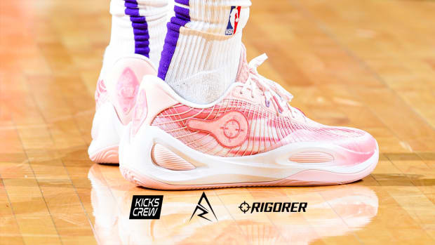 Los Angeles Lakers guard Austin Reaves' pink and white Rigorer sneakers.