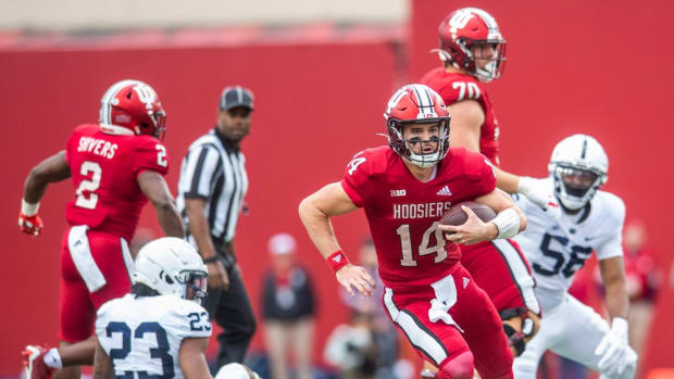 Indiana's Jack Tuttle (14) runs during the first half of the Indiana versus Penn State football game at Memorial Stadium on Satruday, Nov. 5, 2022.