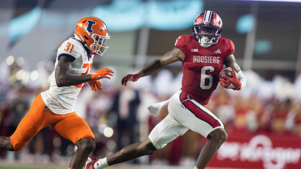 Indiana Hoosiers wide receiver Cam Camper (6) runs with the ball after a catch while Illinois Fighting Illini defensive back Devon Witherspoon (31) defends in the second quarter at Memorial Stadium.