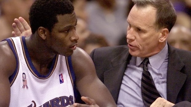 Oct 20, 2001; Washington, DC, USA; FILE PHOTO; Washington Wizards head coach Doug Collins talks with rookie center Kwame Brown on the bench during a Wizards game