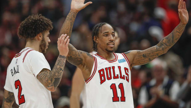 November 8, 2021; Chicago Bulls' DeMar DeRozan celebrates with  Lonzo Ball after a basket vs. the Brooklyn Nets at United Center.