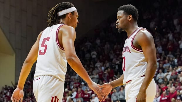 Indiana Hoosiers forward Malik Reneau (5) high-fives Indiana Hoosiers guard Xavier Johnson (0) against the Ohio State Buckeyes during the second half at Simon Skjodt Assembly Hall.