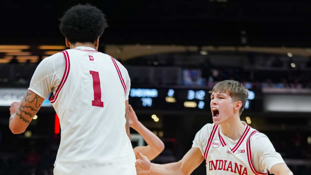 Indiana Hoosiers guard Gabe Cupps (2) celebrates with Indiana Hoosiers center Kel'el Ware (1) after a basket during the game against Harvard in Gainbridge Fieldhouse in Indianapolis, Ind. on Sunday, Nov. 26, 2023.