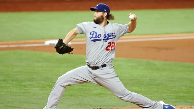 Oct 25, 2020; Arlington, Texas, USA; Los Angeles Dodgers starting pitcher Clayton Kershaw (22) pitches against the Tampa Bay Rays during the first inning during the first inning during game five of the 2020 World Series at Globe Life Field. Mandatory Credit: Kevin Jairaj-USA TODAY Sports