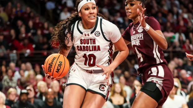 Kamilla Cardoso drives around Mississippi State Bulldogs