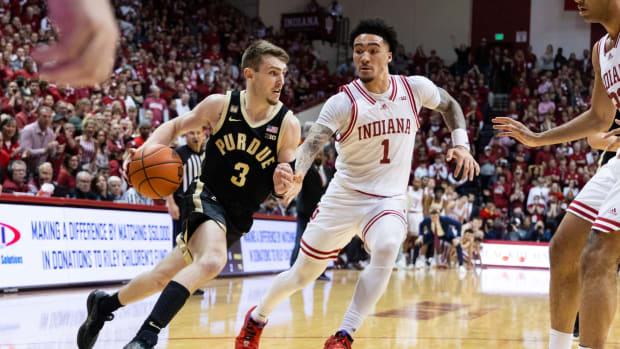 Purdue Boilermakers guard Braden Smith (3) dribbles the ball while Indiana Hoosiers guard Jalen Hood-Schifino (1) defends in the second half at Simon Skjodt Assembly Hall.