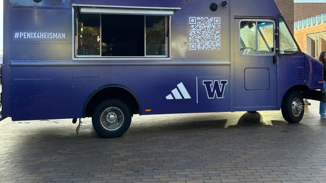 Purple truck with adidas and Washington Huskies branding.