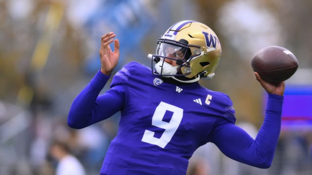 Washington Huskies quarterback Michael Penix Jr. throws the football.