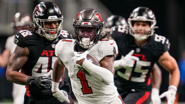 Tampa Bay Buccaneers running back Rachaad White (1) runs for a touchdown against the Atlanta Falcons during the second half at Mercedes-Benz Stadium.