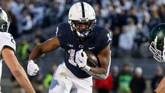 Penn State Nittany Lions running back Nicholas Singleton on a run during a college football game in the Big Ten.