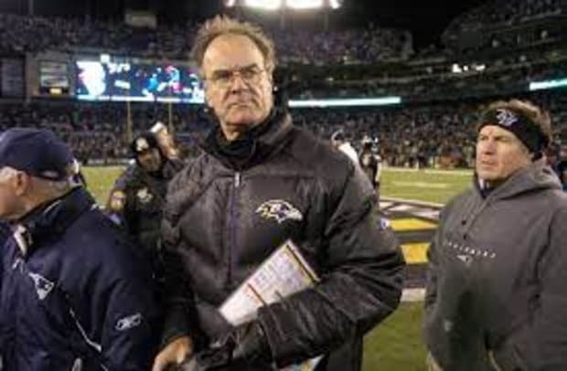 A disappointed Baltimore Ravens' head football coach Brian Billick, watches  the scoreboard replay after falling behind, 14-0 against the St. Louis  Rams, early in the first quarter at the Edward Jones Dome