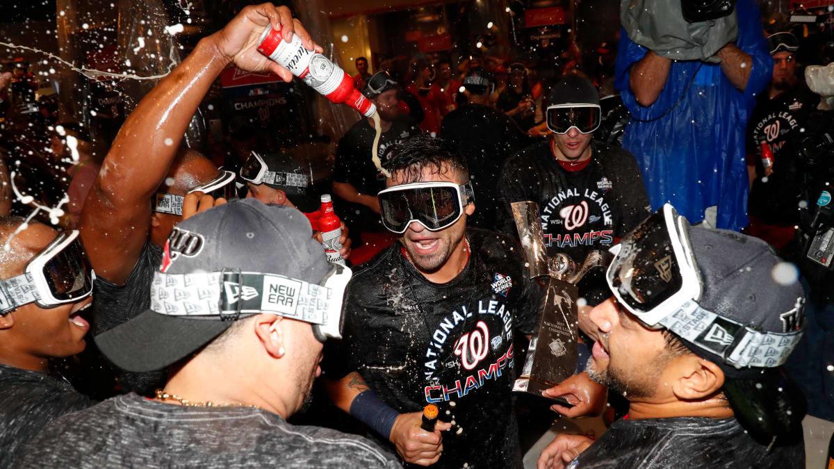 Dozier's shirt has a picture of him guzzling booze in the locker room after  NLCS victory