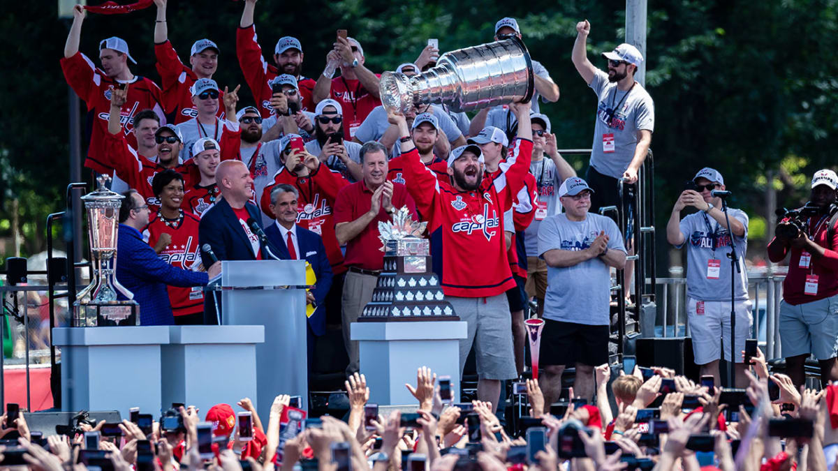 Washington Capitals' T.J. Oshie chugs a beer through his jersey at Stanley  Cup rally 