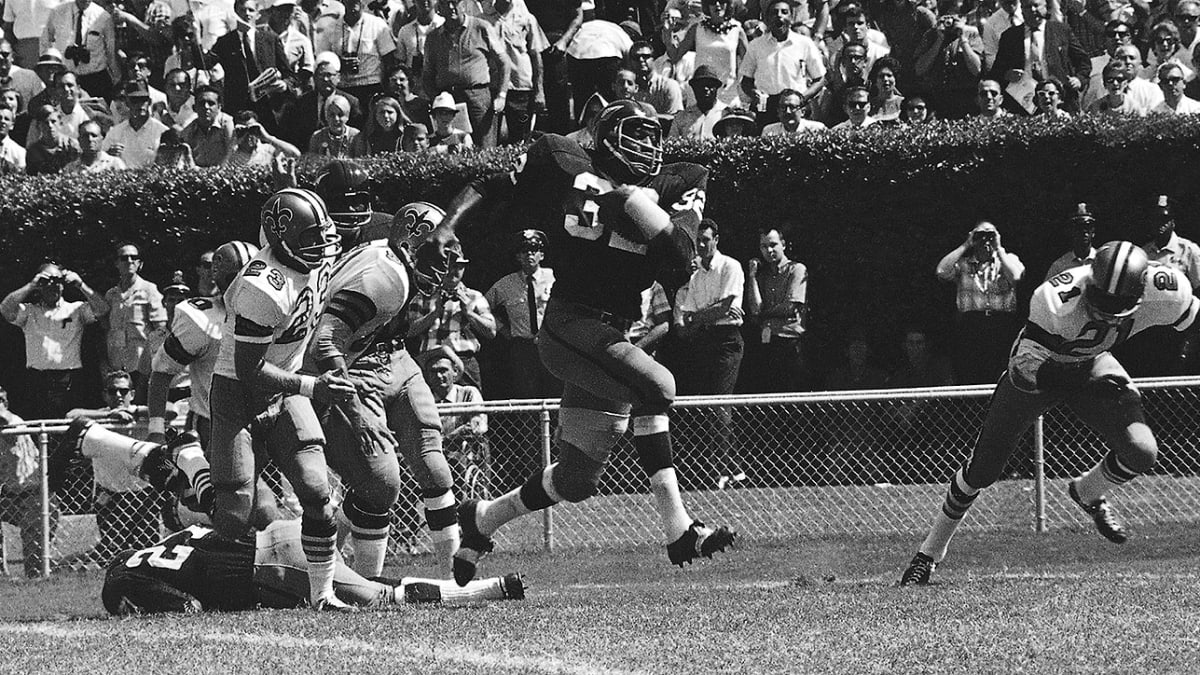 Ray McDonald of the Washington Redskins hurdles over Freeman White of the New  York Giants and Clarence Childs of the Giants give him a shove in the  fourth quarter on Oct. 1, 1967 at Washington. The play netted the Skins a  couple of yards. Washington