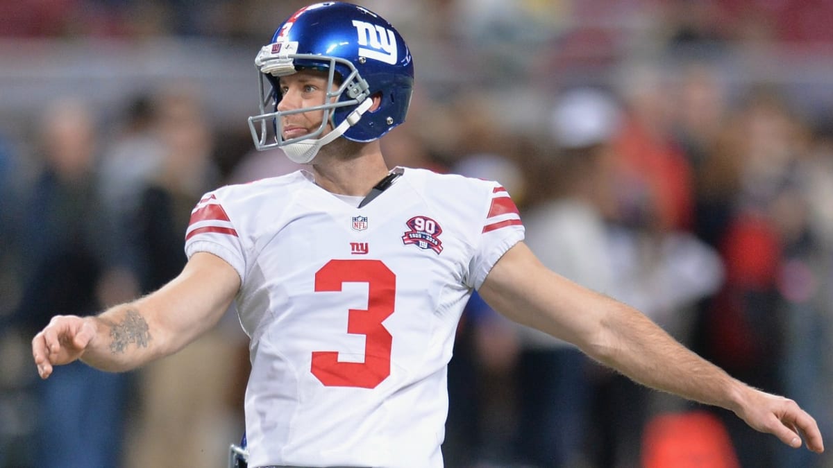 A fan in the stands wears an old Josh Brown jersey with Brown's