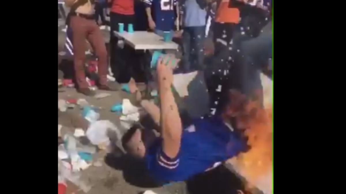 Bills Mafia Fan Smashing Table Caught On Fire GIF