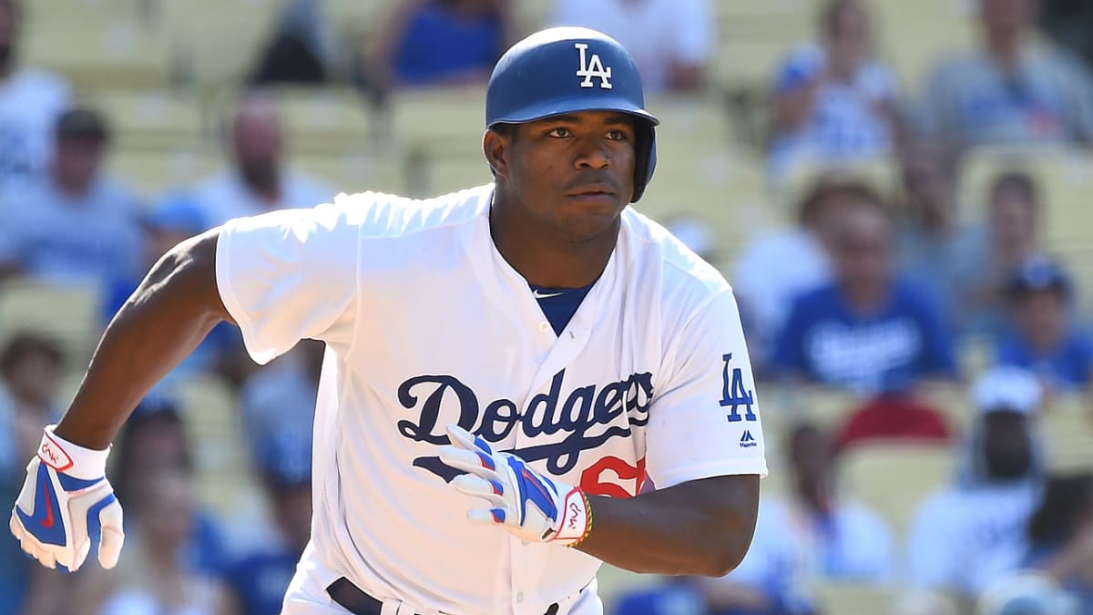 Dodgers' Yasiel Puig lets children give him a new hairdo for a