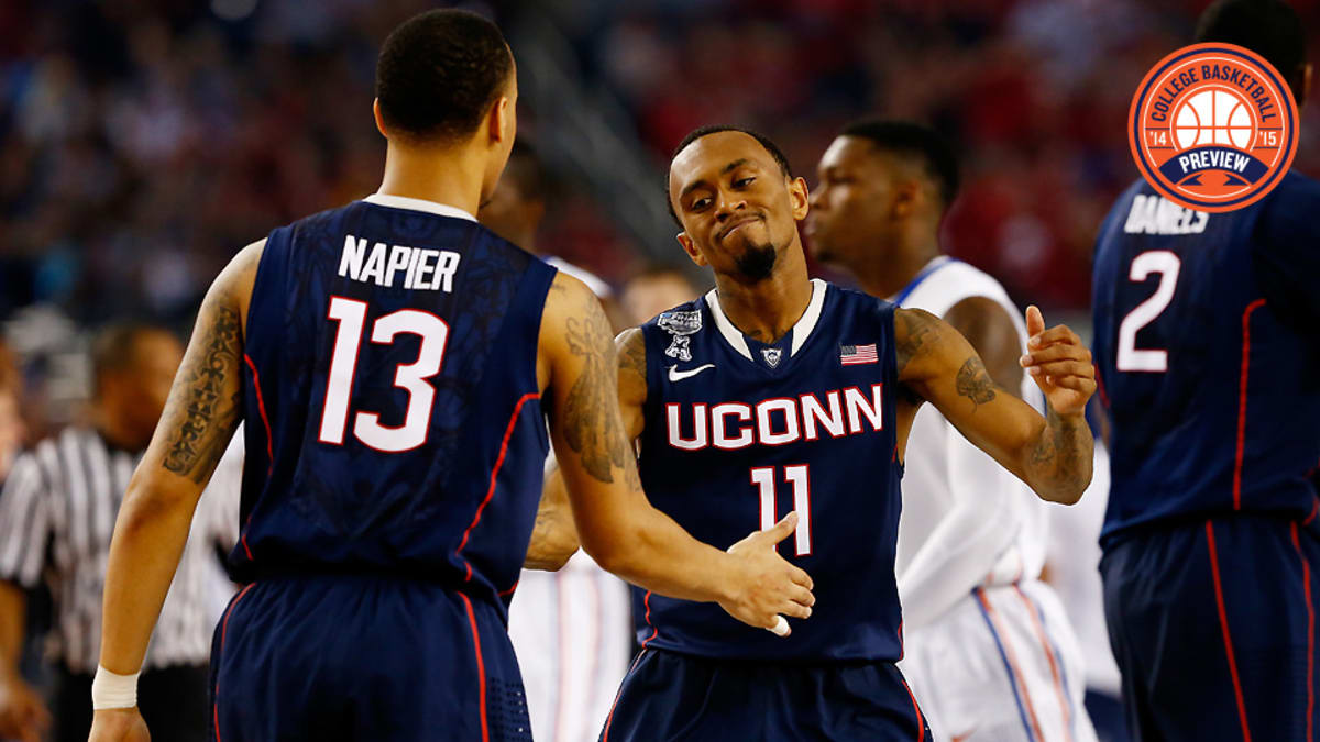 Connecticut's Shabazz Napier, right, is greeted by NBA