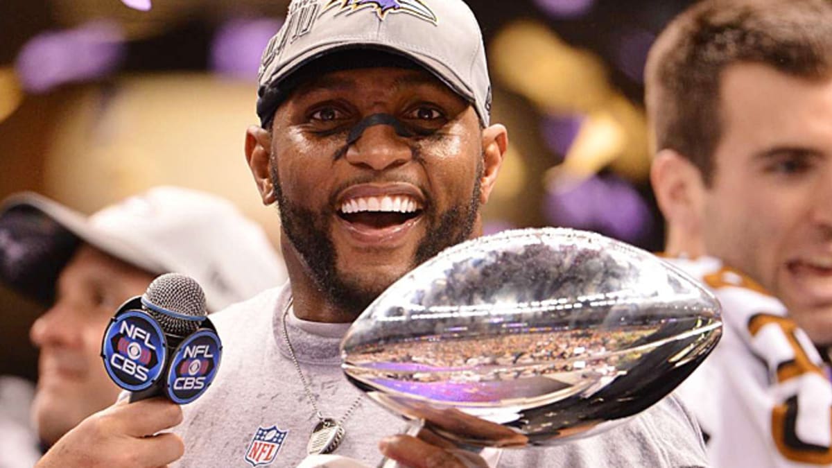 Baltimore Ravens safety Ed Reed lifts the Lombardi trophy with