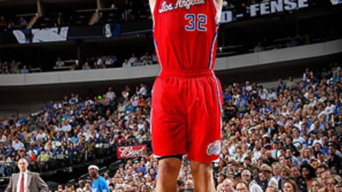 Blake Griffin elevates for a jumper in red Clipper jersey