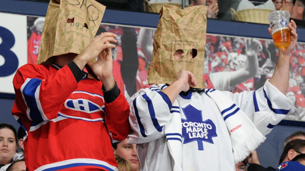 Miami Dolphins fans wear paper bags on their heads before an NFL