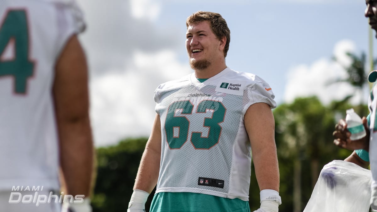 Miami Dolphins guard Michael Deiter (63) heads onto the field for warmups  before the start of a NFL preseason football game against the Las Vegas  Raiders, Saturday, Aug. 20, 2022, in Miami