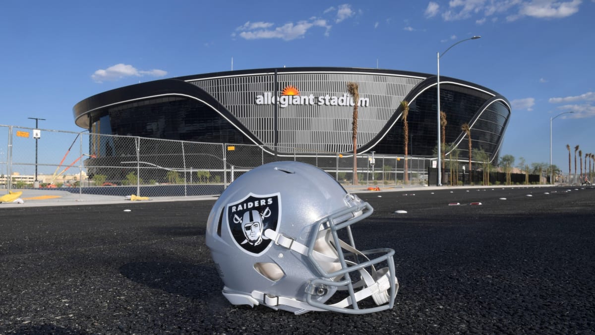 A Las Vegas Raiders helmet and Wilson 2020 NFL “The Duke” official football  at the Allegiant Stadium construction site, Thursday, June 4, 2020, in Las  Vegas. The stadium will be the home