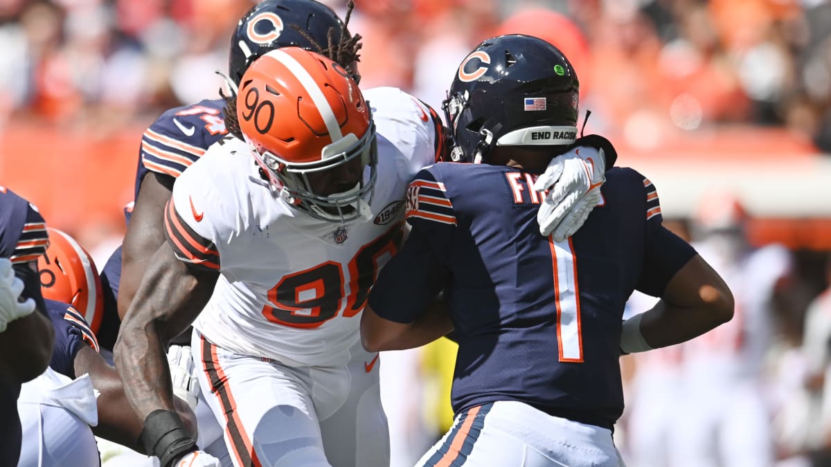 NFL field judge Nate Jones stands between players during an NFL preseason  football game between the Cleveland Browns and the Chicago Bears, Saturday,  Aug. 27, 2022, in Cleveland. The Bears won 21-20. (