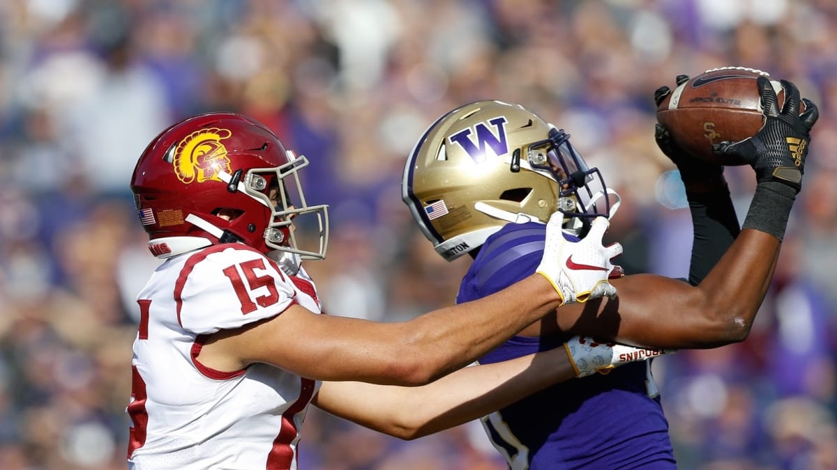 Washington Huskies wide receiver Jabez Tinae (15) runs with the