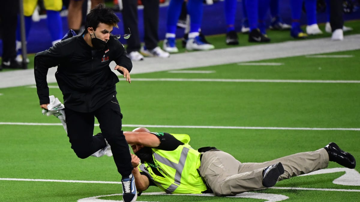 Photos: Fan tackled after running onto SoFi Stadium field during Super Bowl