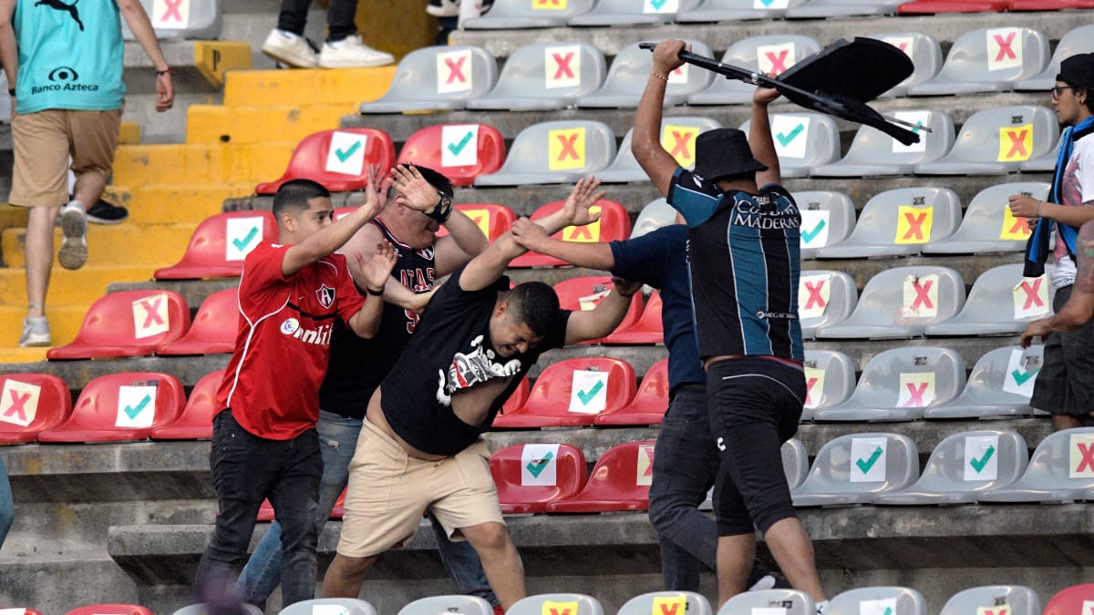 Liga MX match ends after horrific violence in stands spills onto field -  Sports Illustrated