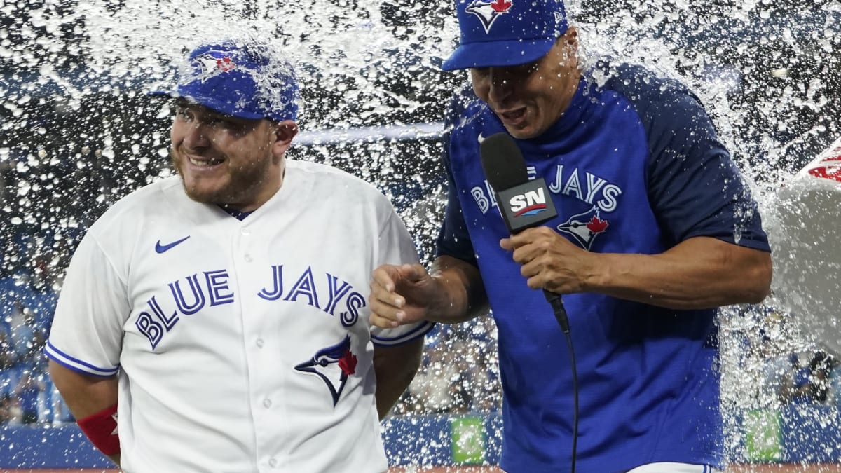 ST. PETERSBURG, FL - MAY 15: Toronto Blue Jays catcher Alejandro Kirk (30)  celebrates his double with his teammates in the dugout during the MLB  regular season game between the Toronto Blue