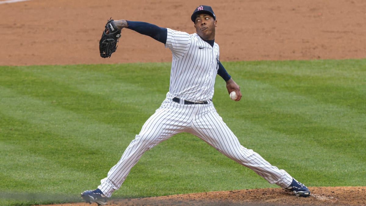 New York Yankees relief pitcher Aroldis Chapman throws a strike in the ninth