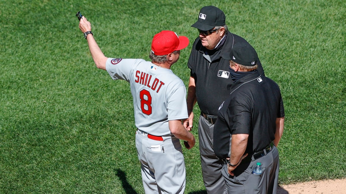 Cardinals reliever Gallegos gets wiped down by umpire after using rosin bag  on his left arm