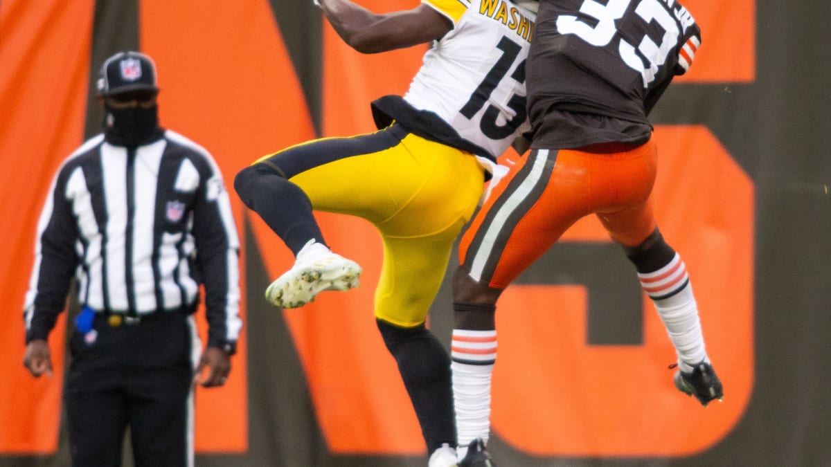 In this Nov. 29, 2020 photo, Cleveland Browns safety Ronnie Harrison Jr.  (33) wears a Salute to Service headband during warm-ups before an NFL  football game against the Jacksonville Jaguars in Jacksonville