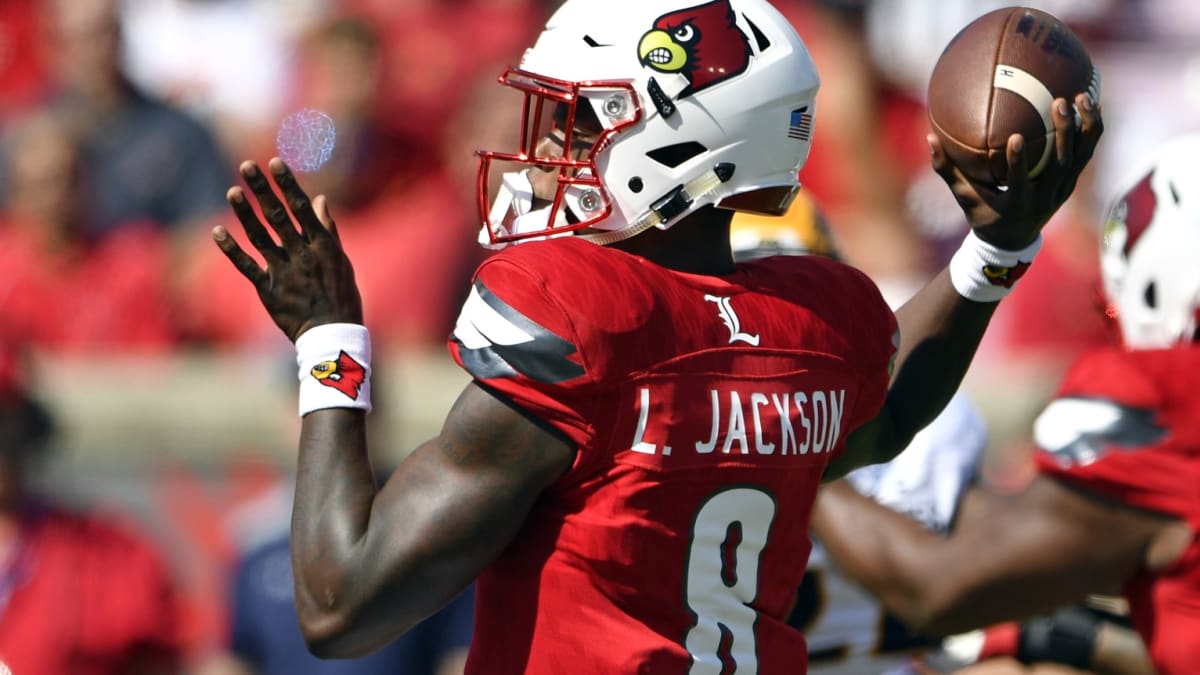 Lamar Jackson Louisville Cardinals Unsigned Red Jersey Throwing Ball Close  Up Photograph